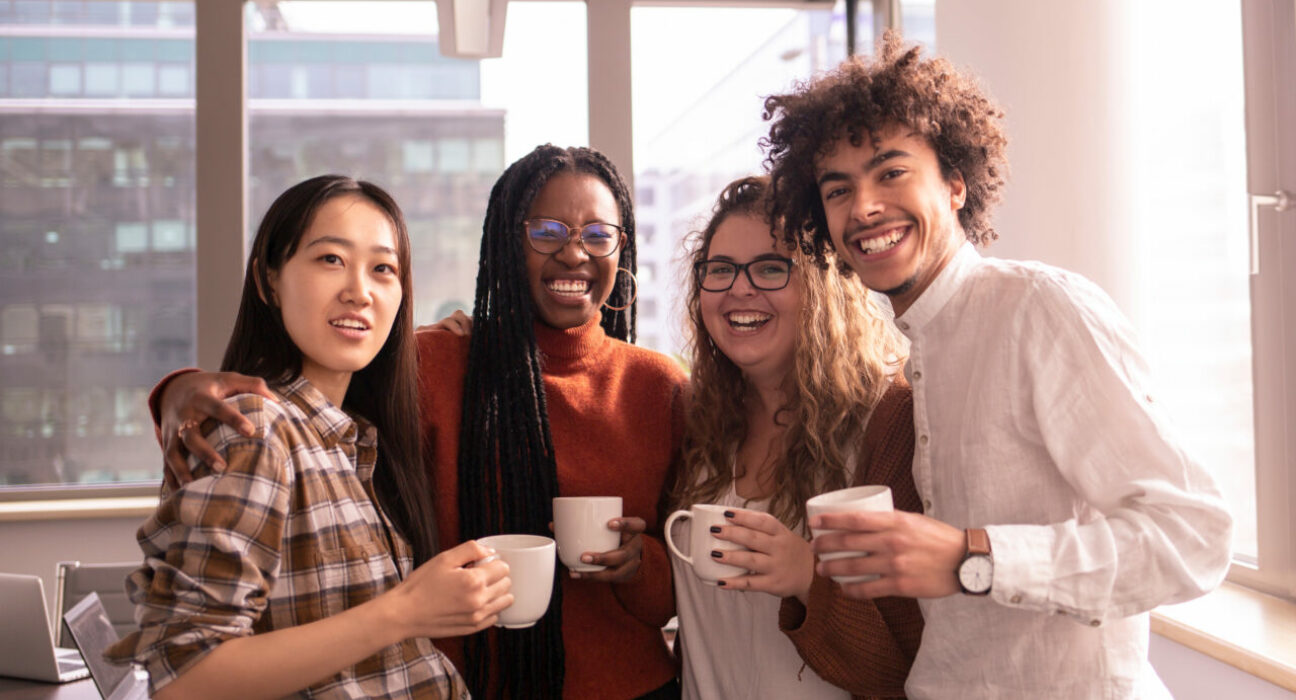 A group of people in the office are taking a break at work