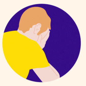 Man in a yellow t-shirt with his head in his hands, on a purple background.