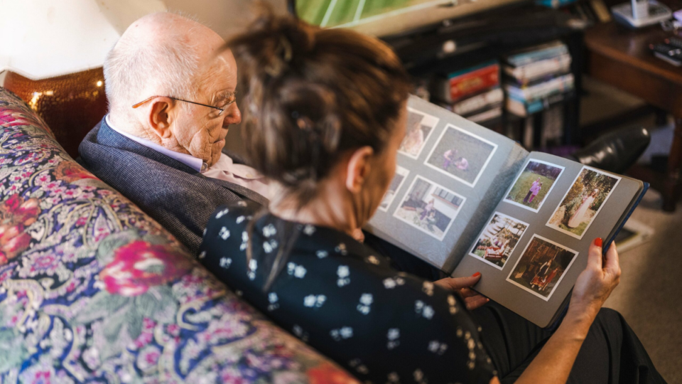 Man and woman looking at a photo album