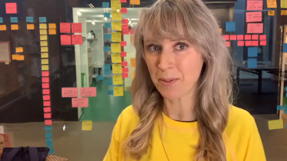 Befriender in a yellow tshirt explaining why she became a befriender.