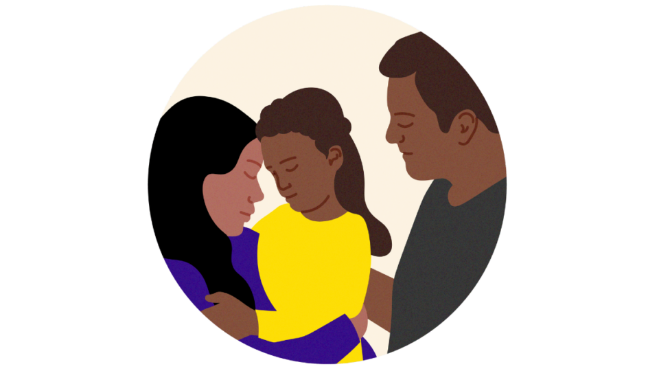 Child with two adults either side. The child is resting her head on the lady's head.