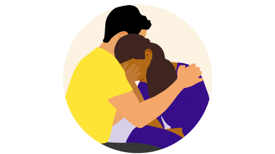 Lady resting her head on someone's shoulder as he supports her, with her hand covering her eyes.