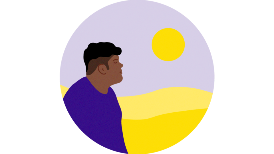 Hopeful man outdoors looking out at the sun in a vast landscape.