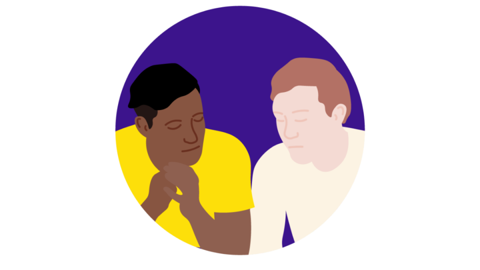 Two people sitting beside each other in support, in front of a purple circle.
