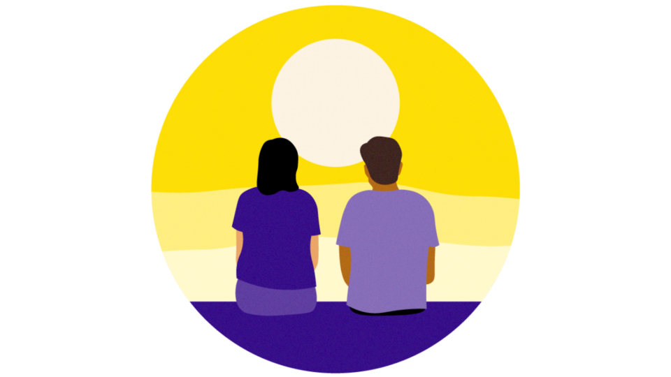Two people with their back to us, facing out onto a vast landscape, looking at the sun.