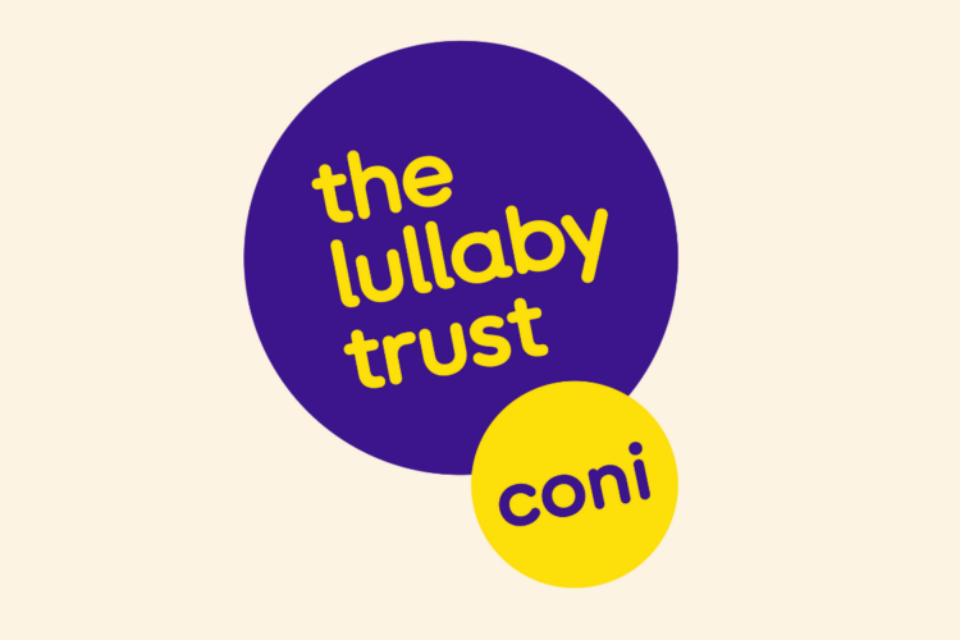 The Care of Next Infant (CONI) logo. Purple circle that says 'The Lullaby Trust' inside, with a smaller yellow circle below, overlapping that says 'CONI'.