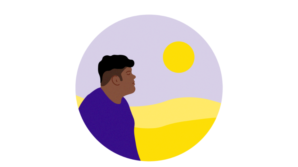 Hopeful man outdoors looking out at the sun in a vast landscape.