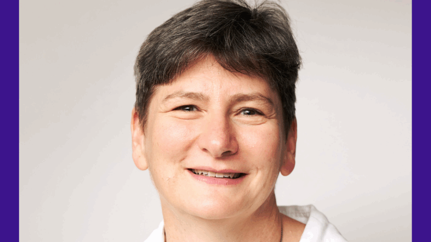 A professional headshot of Dr Joanna Garstang. She has short, dark hair, wears a white blouse, a silver necklace and is smiling.
