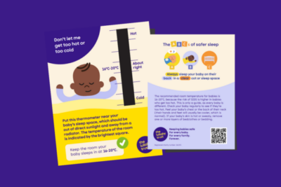 Demonstration of what the room thermometer looks like for babies' rooms. It is a two-sided piece of card with a thermometer on the front, and the ABCs of safer sleep on the back.