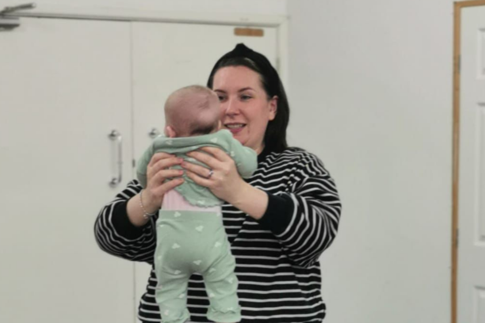 Becky holding her baby.