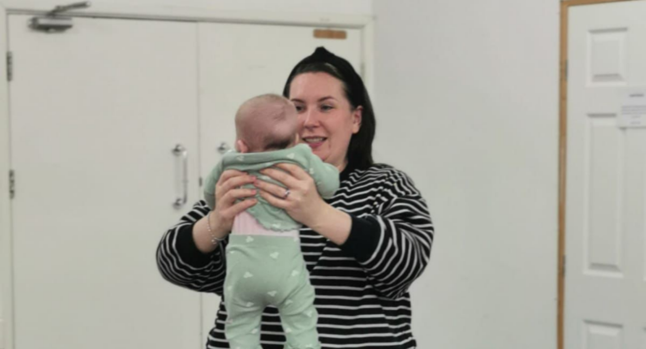 Becky holding her baby.