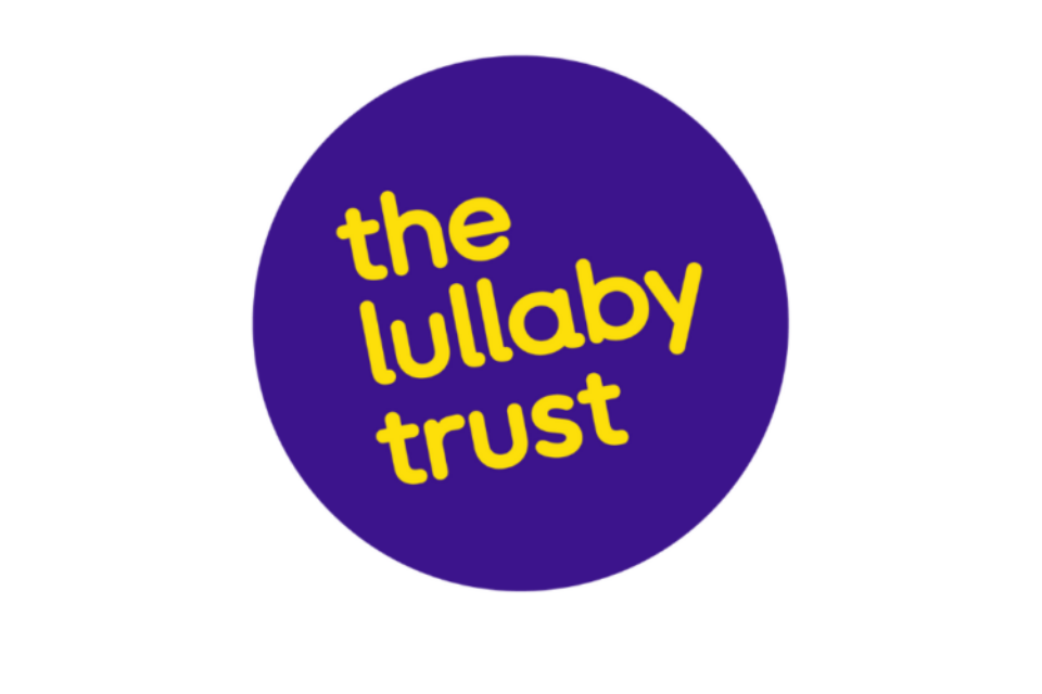 The Lullaby Trust's logo. It is a purple circle with curling text all in lowercase 'the lullaby trust'.