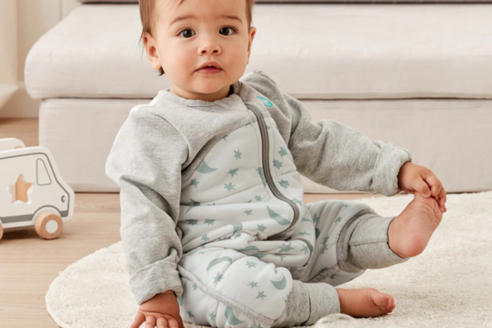 A baby in a sleeping bag