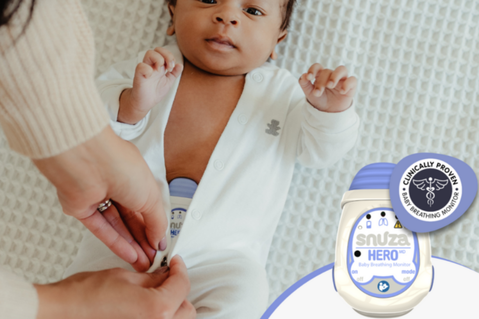 A baby wearing a snuza monitor