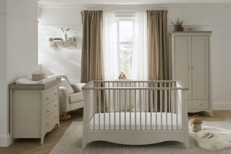Baby's nursery with a cot, wardrobe and drawers
