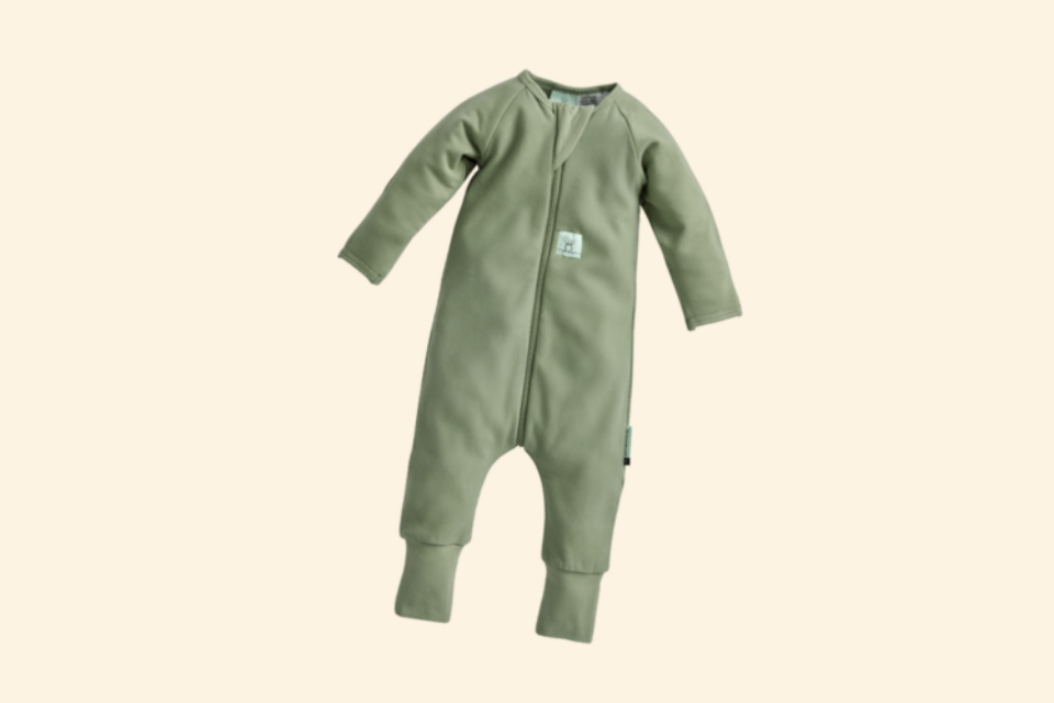 A green baby sleep onesie.