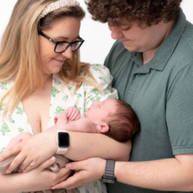 Parent Leanne and Nick holding their baby, Ralph.