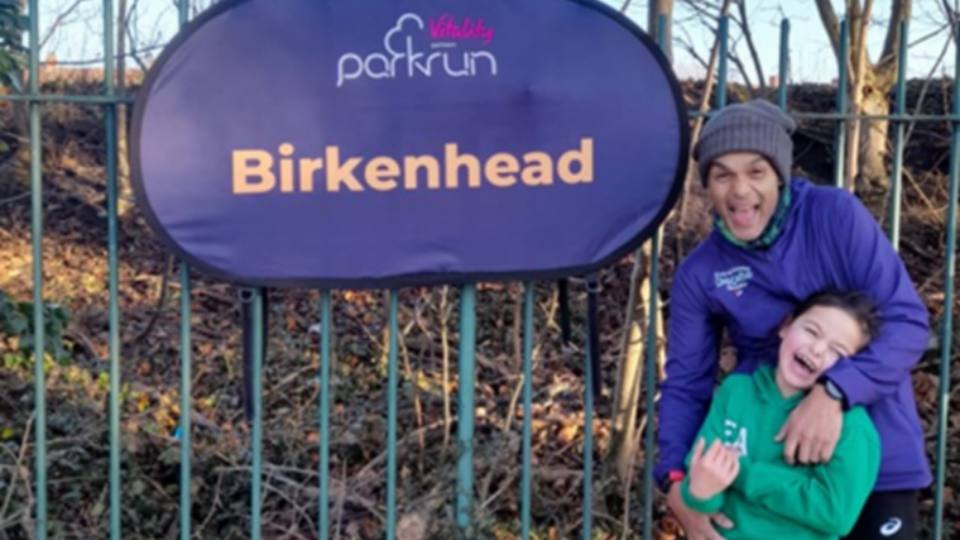Abs with his little girl, Esme, laughing together at a park run.