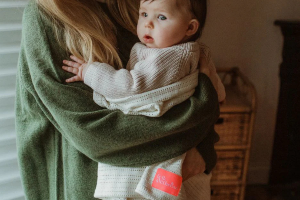 A baby in a cellular blanket