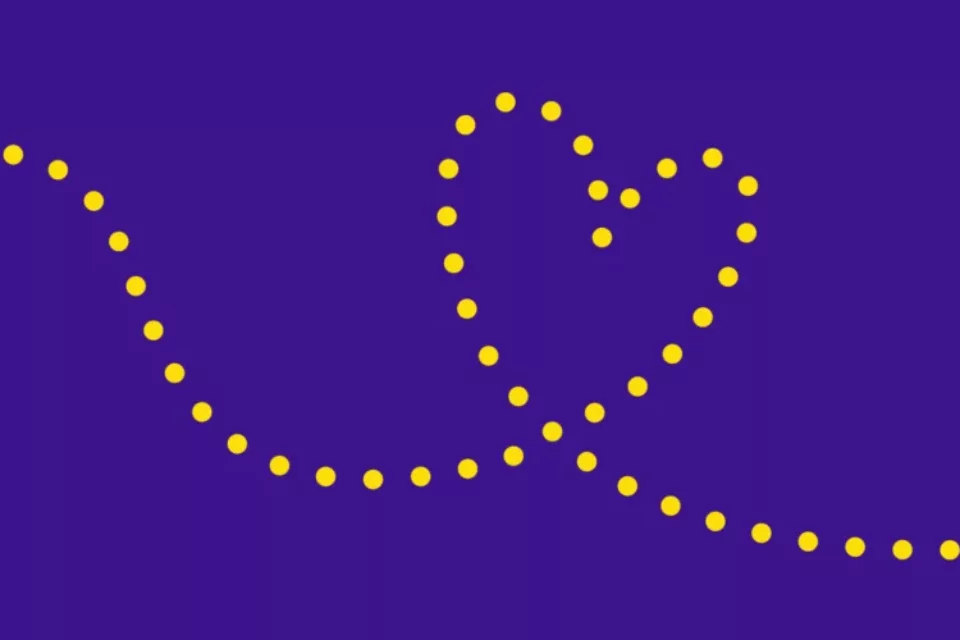 Heart made out of yellow dots, on a purple background.