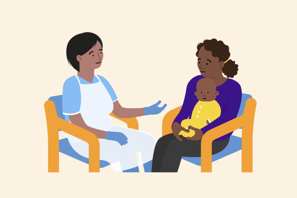 A health professional sitting on a chair, opposite a mum sitting on a chair with her baby on her lap, having a conversation.