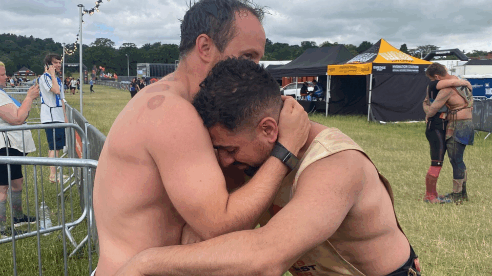 Stefan hugging a friend in support, during the race.
