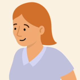 Lady with orange hair and a blue top, smiling.