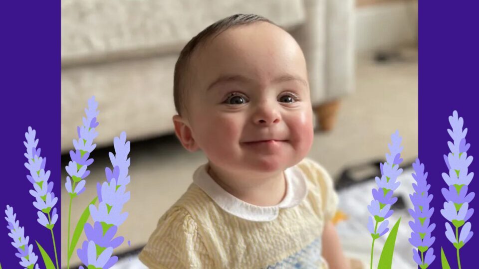 Gigi grins brightly wearing a yellow dress. Her image is surrounded by illustrated lavender.