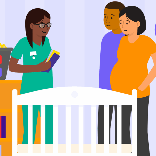 Health professional holding leaflets, standing next to a cot next to a man and a lady.