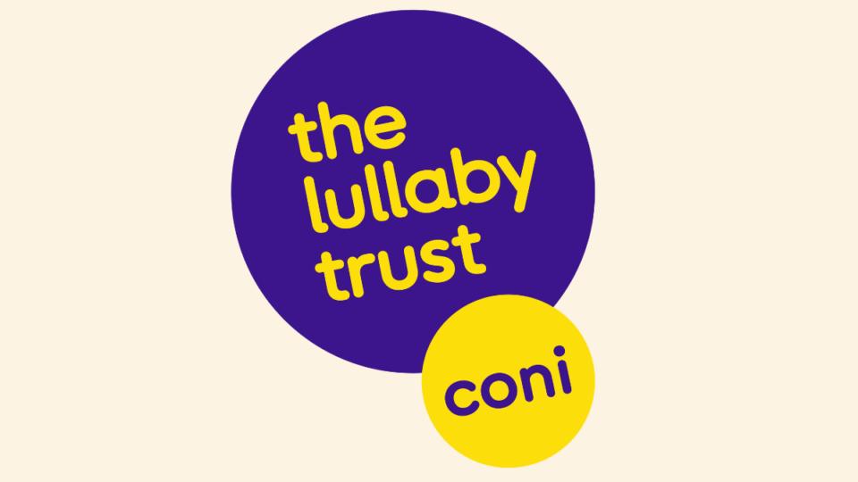The Care of Next Infant (CONI) logo. Purple circle that says 'The Lullaby Trust' inside, with a smaller yellow circle below, overlapping that says 'CONI'.