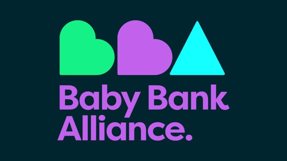 Baby Bank Alliance logo on a dark blue background. Bright green, purple and blue BBA sits as two hearts replicating the Bs and a triangle replicating the A.