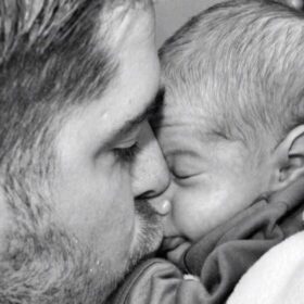 A father kissing his baby