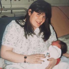 Christine with her daughter, Nerice, sitting up in bed.