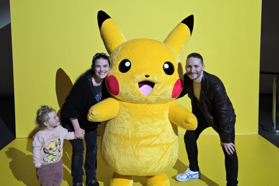 Helen, Gareth and Aerith posing with Pikachu.
