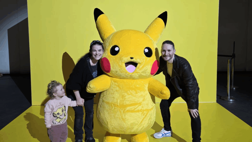 Helen, Gareth and Aerith posing with Pikachu.
