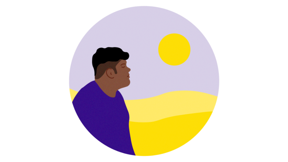 Person looking out towards the sun, looking hopeful