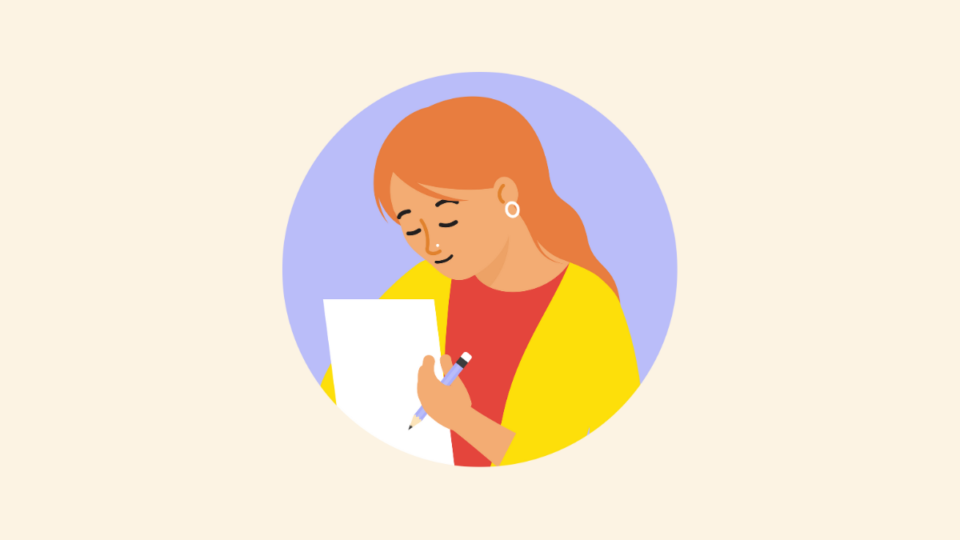 Lady wearing yellow cardigan holding a piece of paper and a pen.