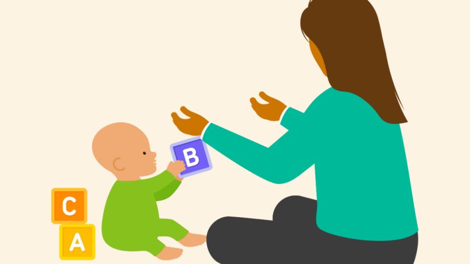 An illustration of an early years practitioner engaging with a young baby, playing with alphabet blocks,
