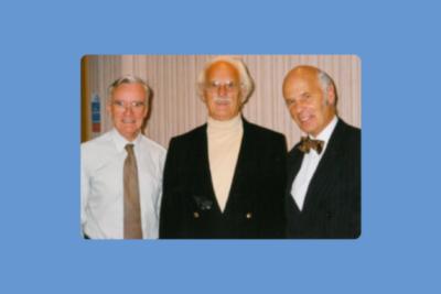 An image of three men dressed formally. Dr Angus Gibson, Professor Gavin Arneil and Dr John McClure