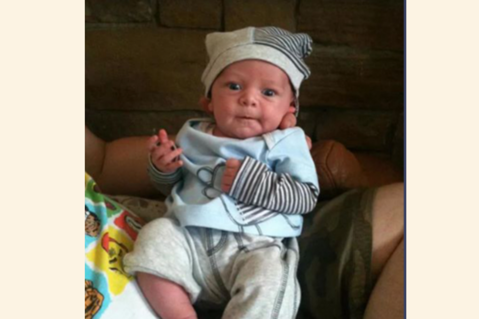 Baby Olli wearing stripy hat