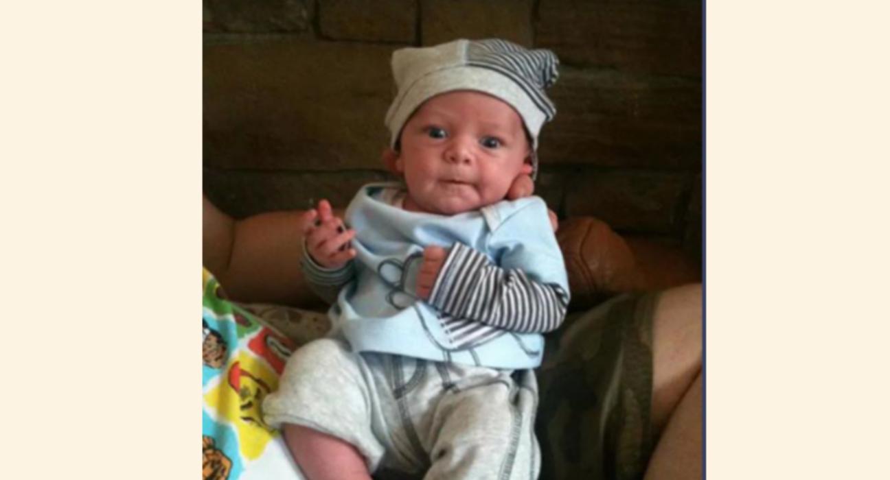 Baby Olli wearing stripy hat