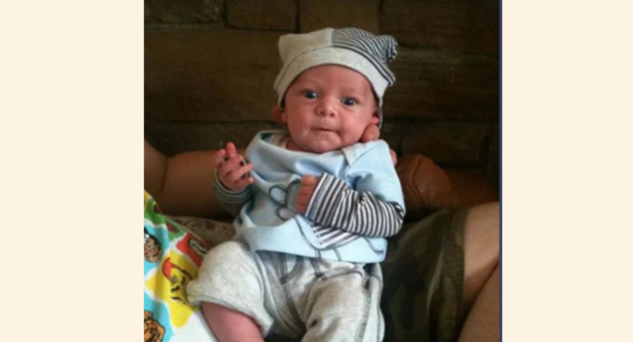 Baby Olli wearing stripy hat