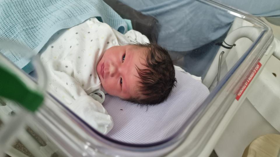 Baby Theo in hospital bed