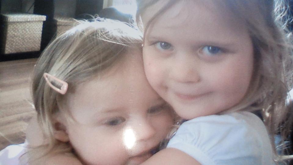 Sue's daughters hugging