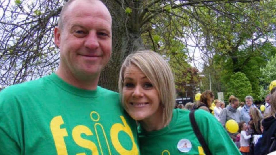 Sue and her husband wearing green FSID t-shirts