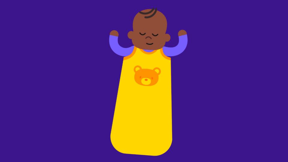 Baby sleeping in a yellow sleep bag.