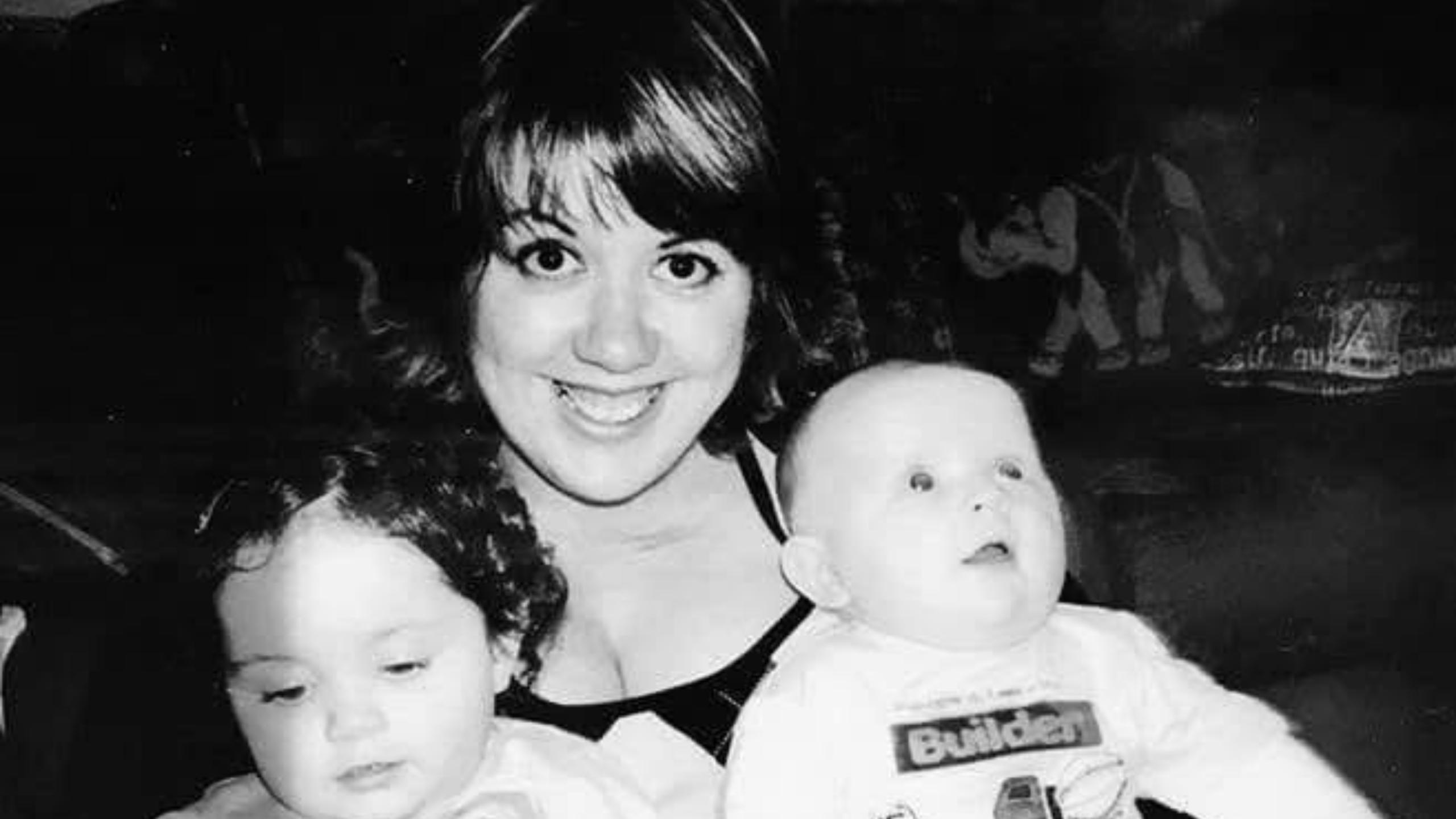 Kirsty with her two children in a black and white photo