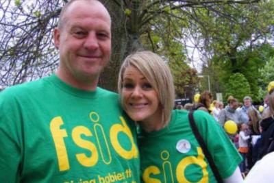 Sue and her husband wearing green FSID t-shirts