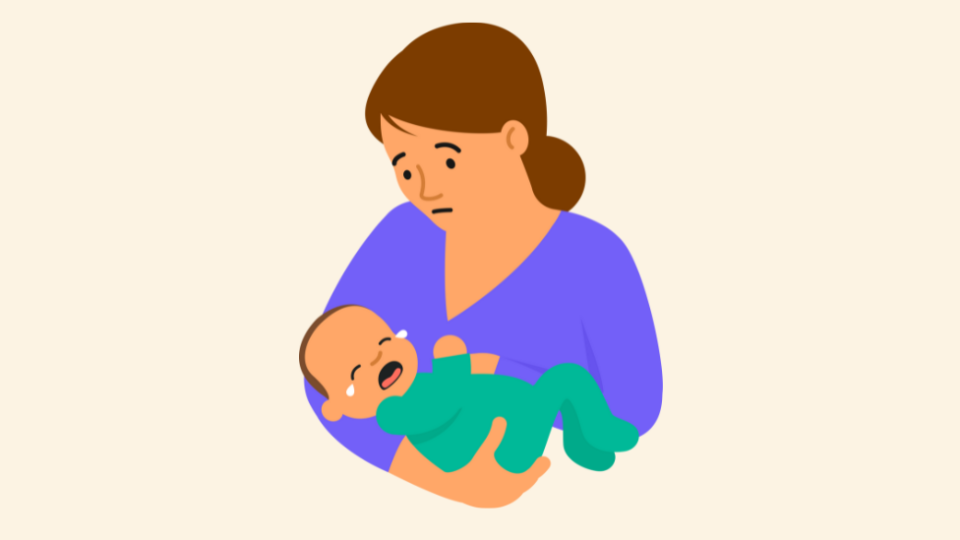 Mother holding a crying baby