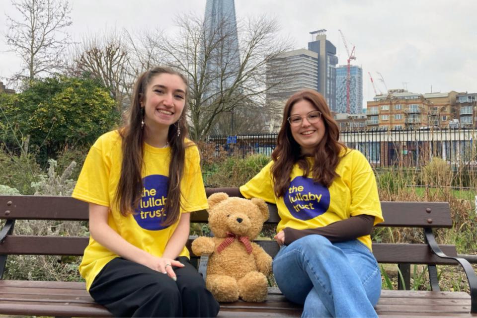 Jodie and Hannah sitting on a bench